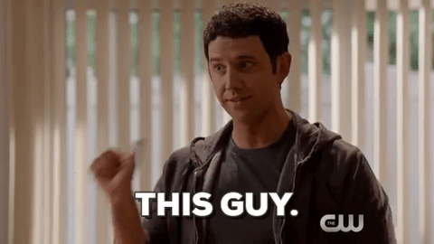Santino Fontana as Greg Serrano in an episode of Crazy Ex-Girlfriend, pointing his thumbs at himself, with caption «This guy.»